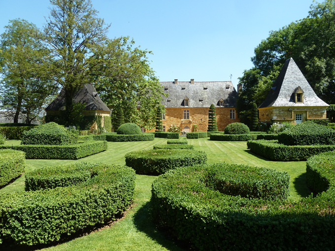 The French  Formal Garden provides an open and elegant space in front of the well-proportioned Manoir d'Artaban.